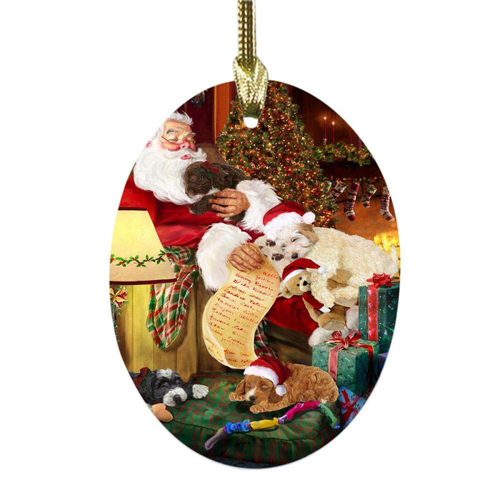 Cockapoos Dog and Puppies Sleeping with Santa Oval Glass Christmas Ornament OGOR49270