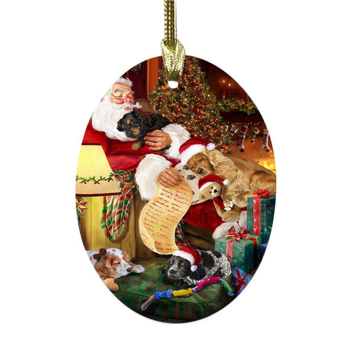 Cocker Spaniels Dog and Puppies Sleeping with Santa Oval Glass Christmas Ornament OGOR49271