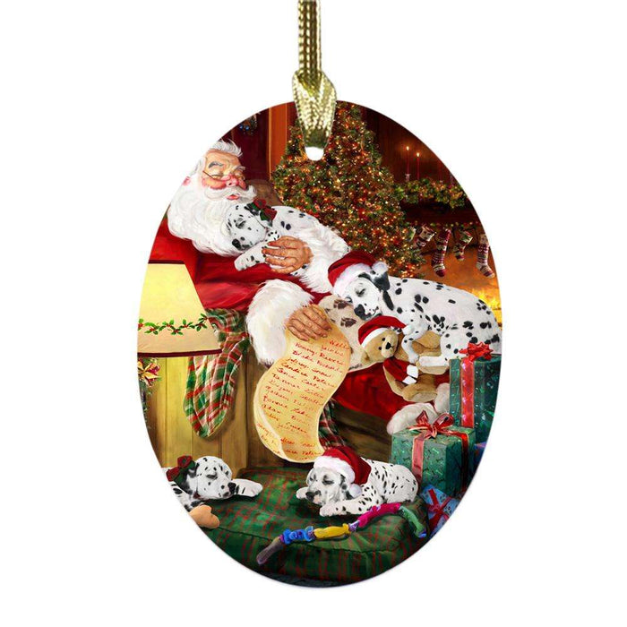 Dalmatians Dog and Puppies Sleeping with Santa Oval Glass Christmas Ornament OGOR49276