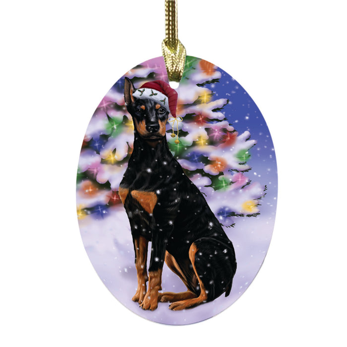 Winterland Wonderland Doberman Dog In Christmas Holiday Scenic Background Oval Glass Christmas Ornament OGOR49570