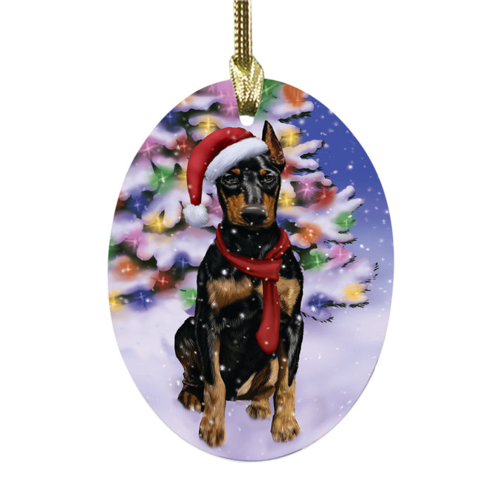 Winterland Wonderland Doberman Dog In Christmas Holiday Scenic Background Oval Glass Christmas Ornament OGOR49571