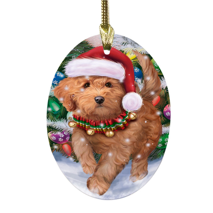 Trotting in the Snow Goldendoodle Dog Oval Glass Christmas Ornament OGOR49449
