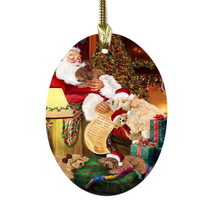 Goldendoodles Dog and Puppies Sleeping with Santa Oval Glass Christmas Ornament OGOR49283