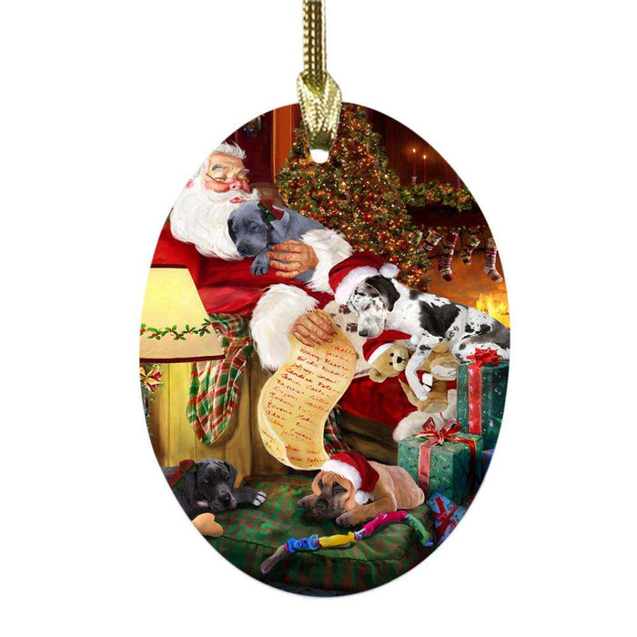 Great Danes Dog and Puppies Sleeping with Santa Oval Glass Christmas Ornament OGOR49284