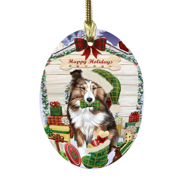 Happy Holidays Christmas Shetland Sheepdog House With Presents Oval Glass Christmas Ornament OGOR49958