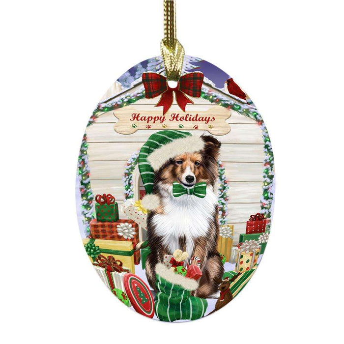 Happy Holidays Christmas Shetland Sheepdog House With Presents Oval Glass Christmas Ornament OGOR49959