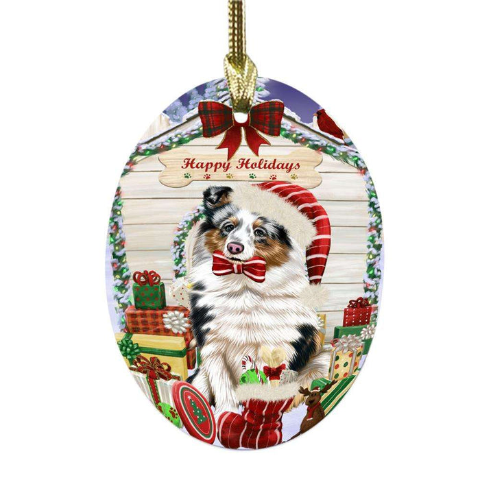 Happy Holidays Christmas Shetland Sheepdog House With Presents Oval Glass Christmas Ornament OGOR49961