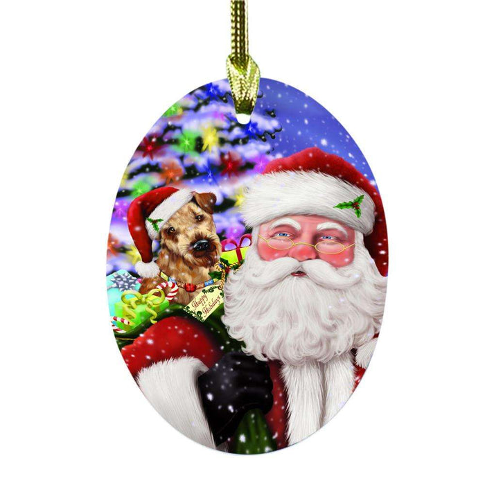 Jolly Old Saint Nick Santa Holding Airedale Dog and Happy Holiday Gifts Oval Glass Christmas Ornament OGOR48792