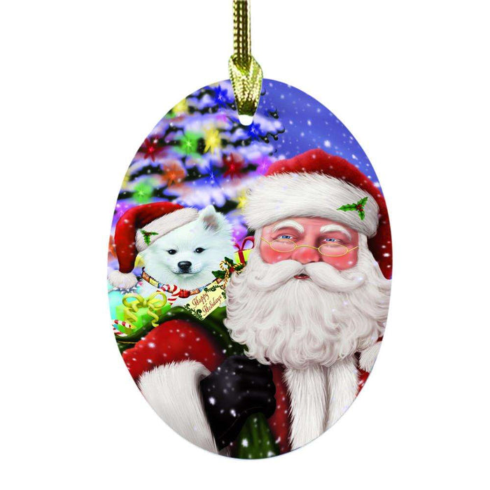 Jolly Old Saint Nick Santa Holding American Eskimo Dog and Happy Holiday Gifts Oval Glass Christmas Ornament OGOR48795