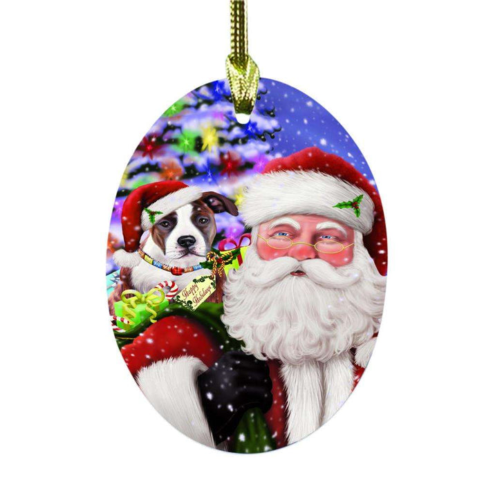 Jolly Old Saint Nick Santa Holding American Staffordshire Dog and Happy Holiday Gifts Oval Glass Christmas Ornament OGOR48798