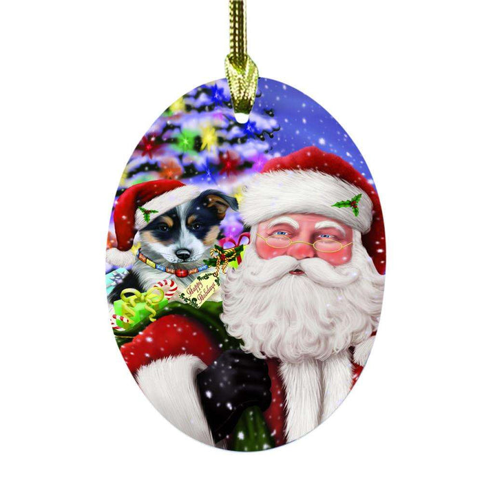 Jolly Old Saint Nick Santa Holding Blue Heeler Dog and Happy Holiday Gifts Oval Glass Christmas Ornament OGOR48821