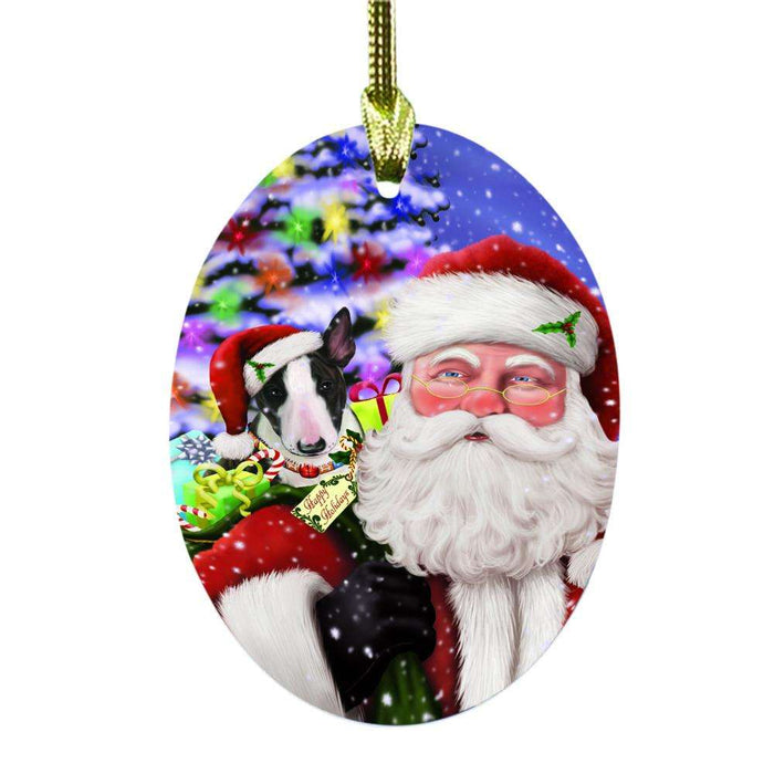Jolly Old Saint Nick Santa Holding Bull Terrier Dog and Happy Holiday Gifts Oval Glass Christmas Ornament OGOR48829