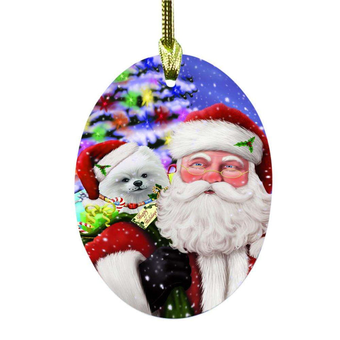 Jolly Old Saint Nick Santa Holding Pomeranian Dog and Happy Holiday Gifts Oval Glass Christmas Ornament OGOR48873