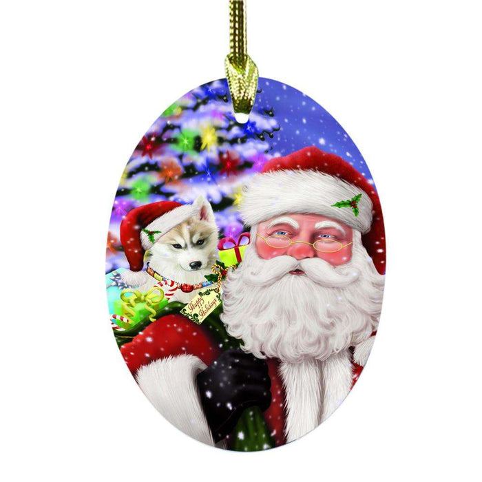 Jolly Old Saint Nick Santa Holding Siberian Husky Dog and Happy Holiday Gifts Oval Glass Christmas Ornament OGOR48887