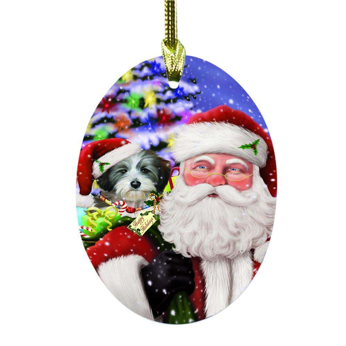 Jolly Old Saint Nick Santa Holding Tibetan Terrier Dog and Happy Holiday Gifts Oval Glass Christmas Ornament OGOR48892