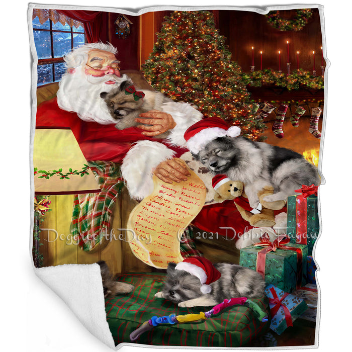 Keeshond Dog and Puppies Sleeping with Santa Blanket