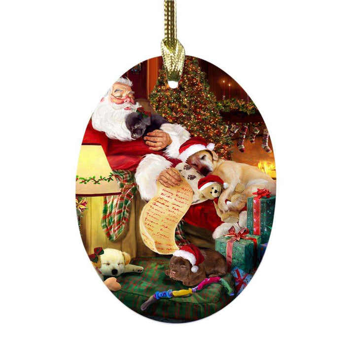 Labrador Retrievers Dog and Puppies Sleeping with Santa Oval Glass Christmas Ornament OGOR49293