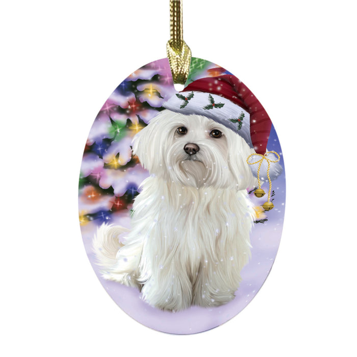 Winterland Wonderland Maltese Dog In Christmas Holiday Scenic Background Oval Glass Christmas Ornament OGOR49604
