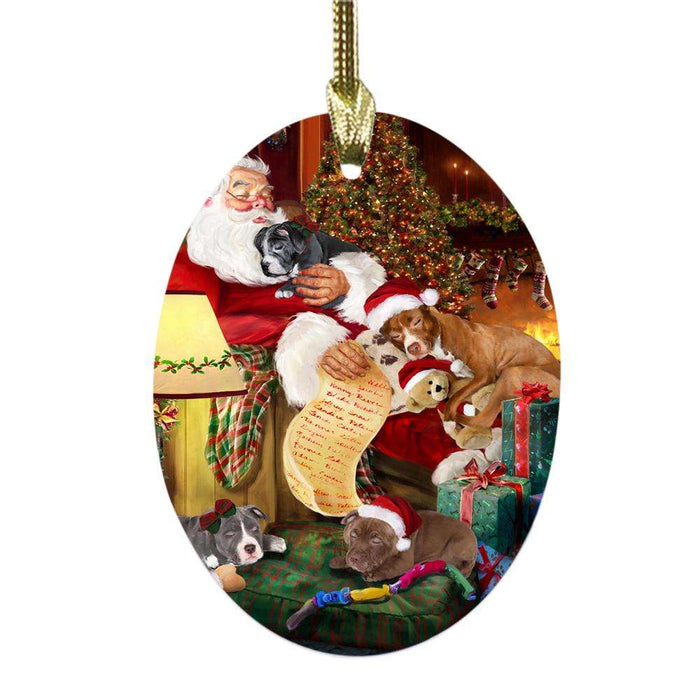 Pit Bulls Dog and Puppies Sleeping with Santa Oval Glass Christmas Ornament OGOR49303