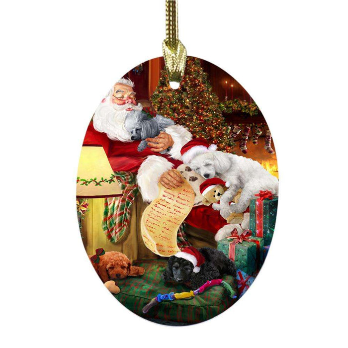 Poodles Dog and Puppies Sleeping with Santa Oval Glass Christmas Ornament OGOR49305