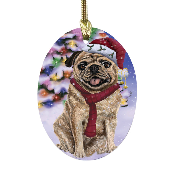 Winterland Wonderland Pug Dog In Christmas Holiday Scenic Background Oval Glass Christmas Ornament OGOR49619