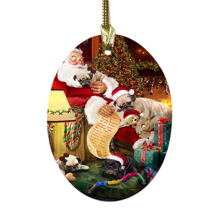 Pugs Dog and Puppies Sleeping with Santa Oval Glass Christmas Ornament OGOR49306