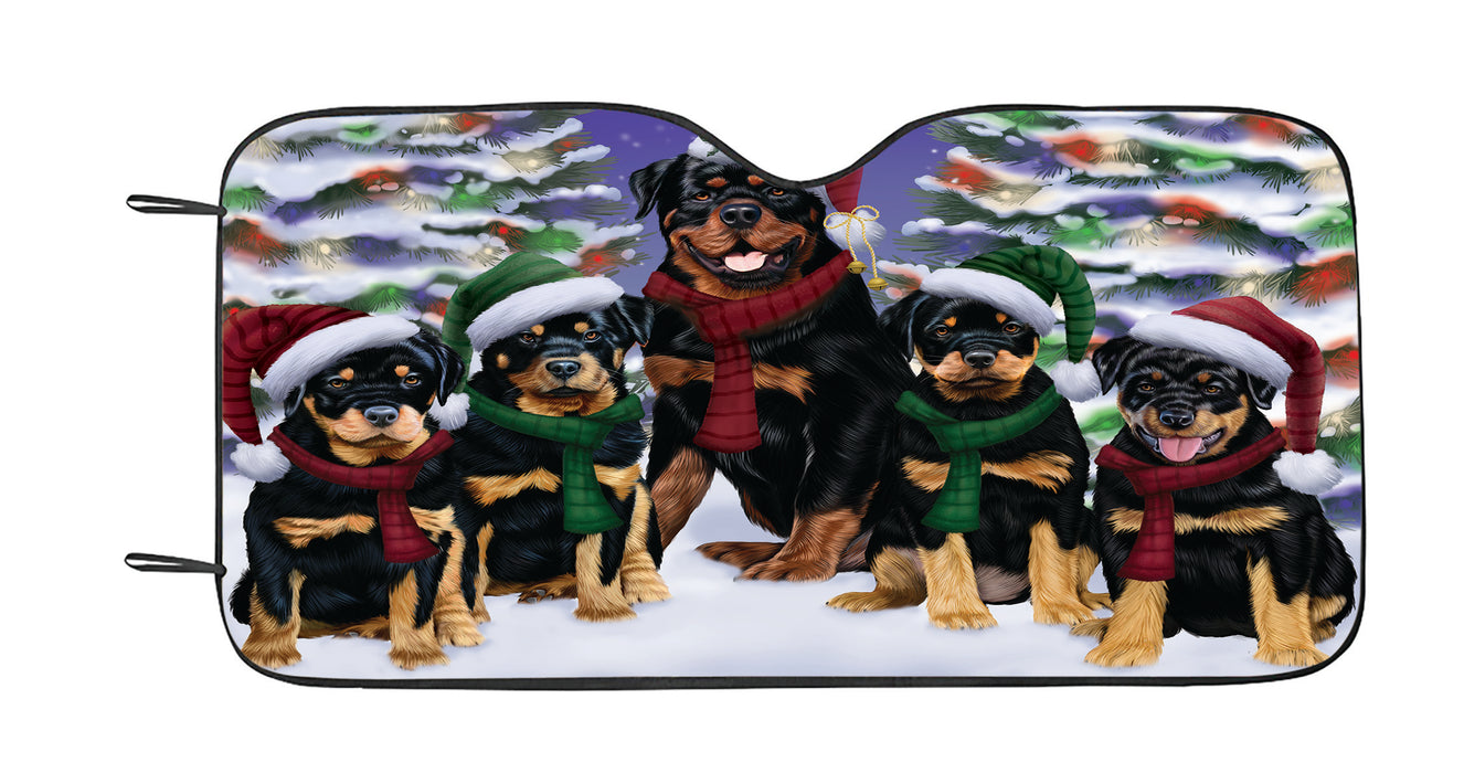 Rottweiler Dogs Christmas Family Portrait in Holiday Scenic Background Car Sun Shade