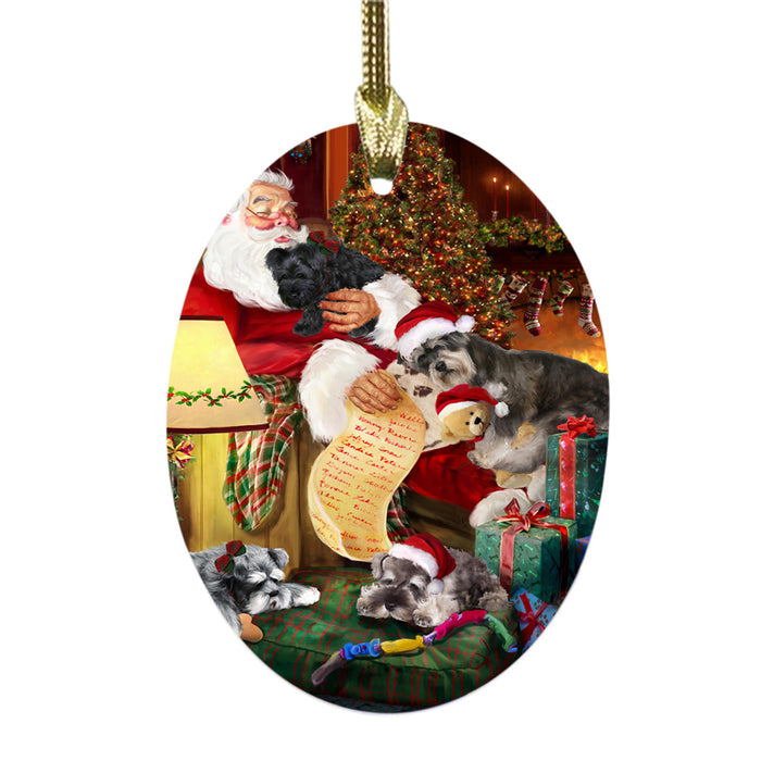 Schnauzers Dog and Puppies Sleeping with Santa Oval Glass Christmas Ornament OGOR49315