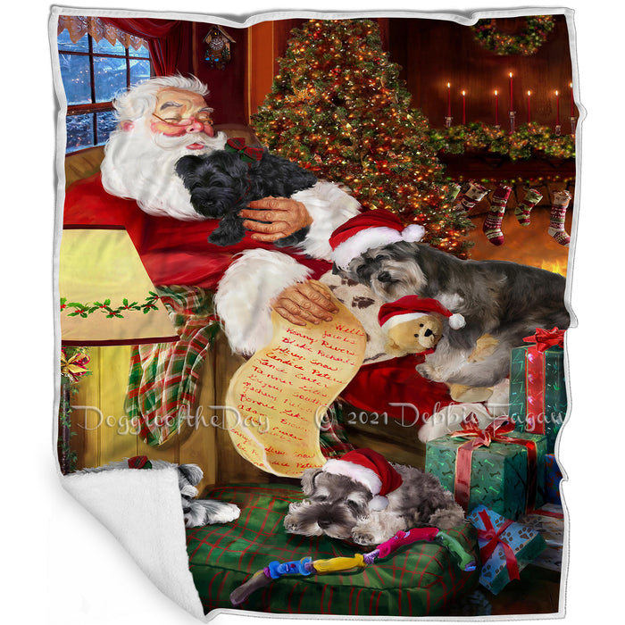 Schnauzer Dog and Puppies Sleeping with Santa Blanket