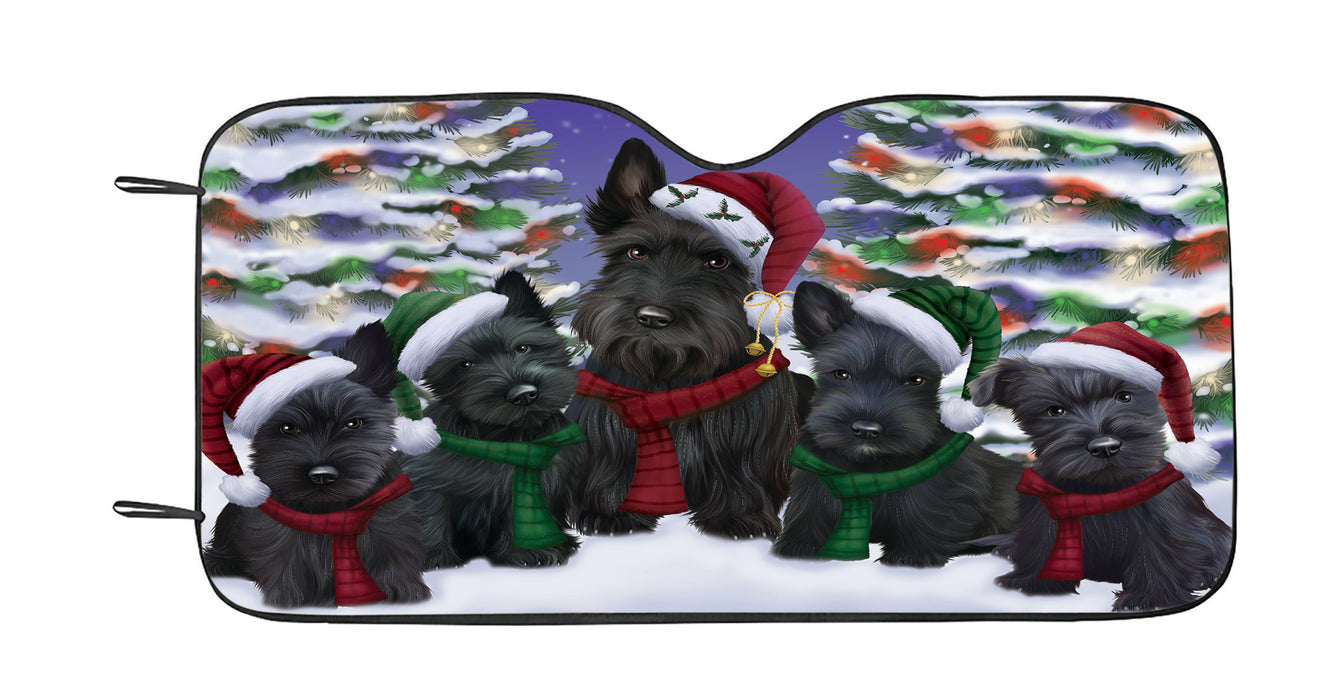 Scottish Terrier Dogs Christmas Family Portrait in Holiday Scenic Background Car Sun Shade