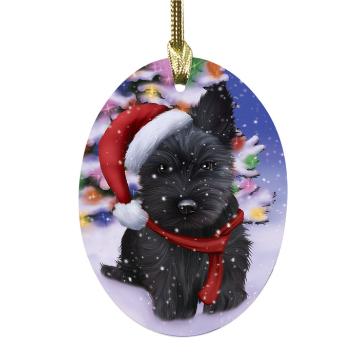 Winterland Wonderland Scottish Terrier Dog In Christmas Holiday Scenic Background Oval Glass Christmas Ornament OGOR49635