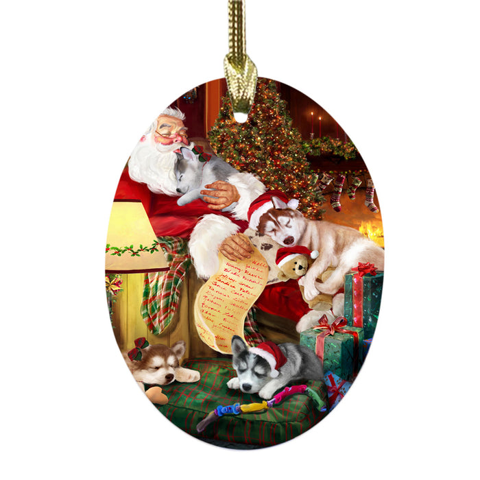 Siberian Huskies Dog and Puppies Sleeping with Santa Oval Glass Christmas Ornament OGOR49321