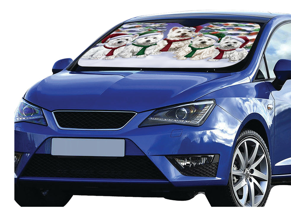 West Highland Terrier Dogs Christmas Family Portrait in Holiday Scenic Background Car Sun Shade