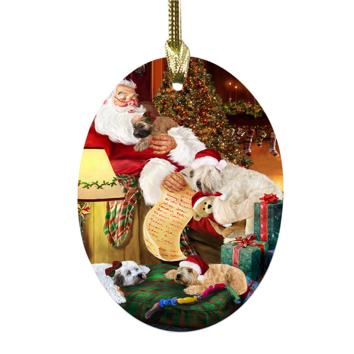 Wheaten Terriers Dog and Puppies Sleeping with Santa Oval Glass Christmas Ornament OGOR49330