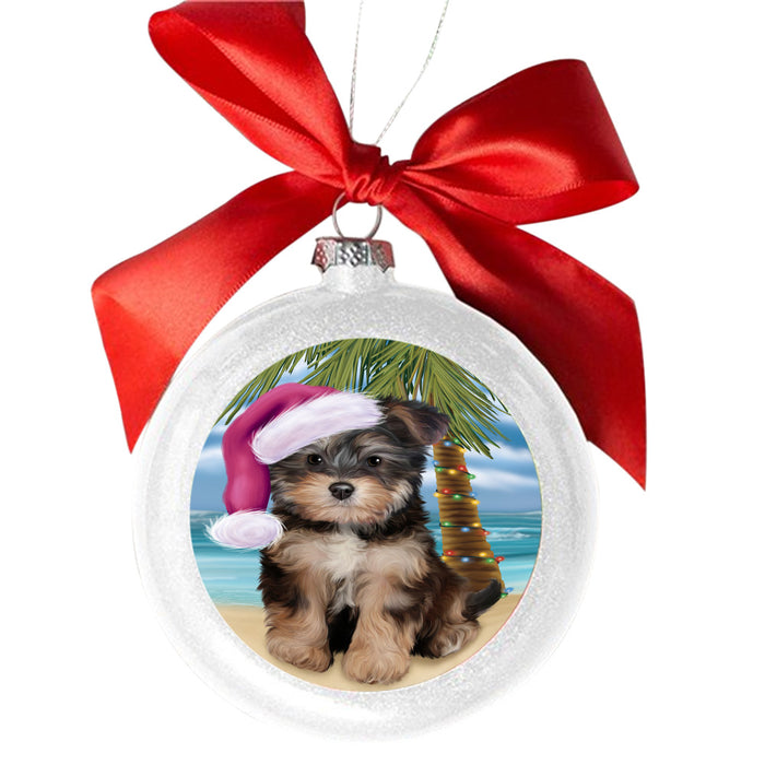 Summertime Happy Holidays Christmas Yorkipoo Dog on Tropical Island Beach White Round Ball Christmas Ornament WBSOR49415